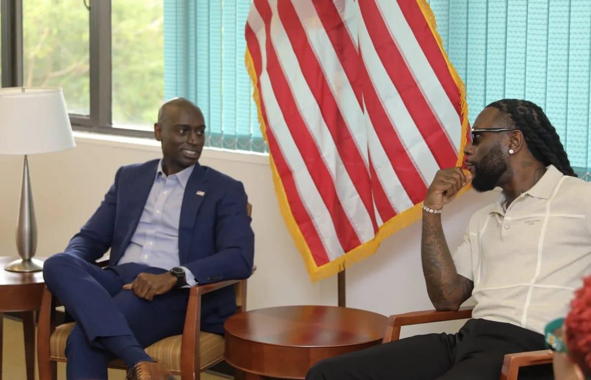 Grammy-winning artist Burna Boy engaging in discussions with U.S. Consul General Brandon Hudspeth at the U.S. Consulate in Lagos.