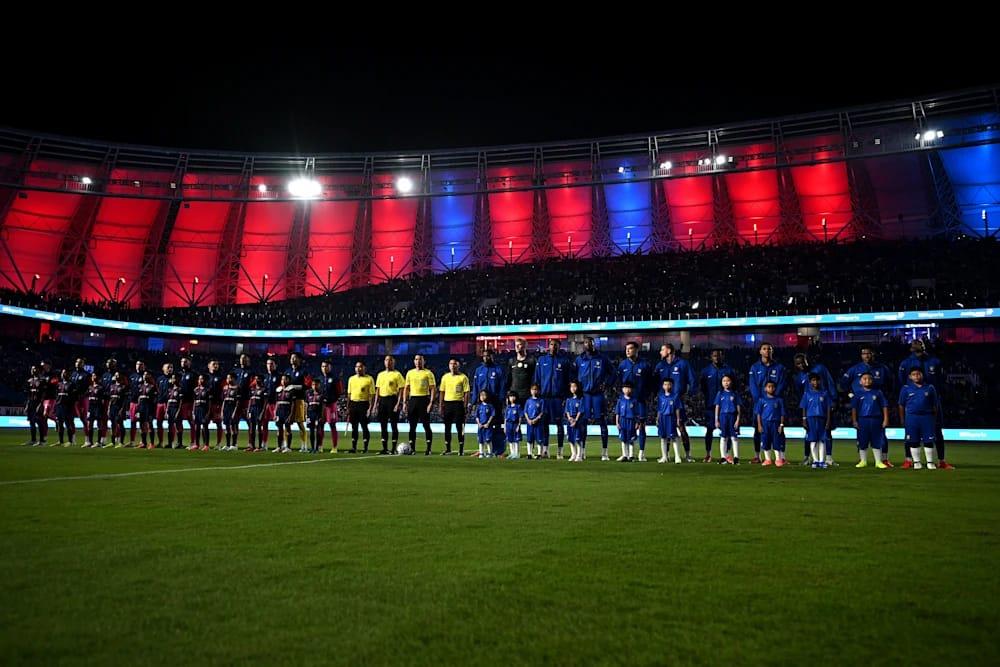 The two teams lined up before the match, ready to give it their all