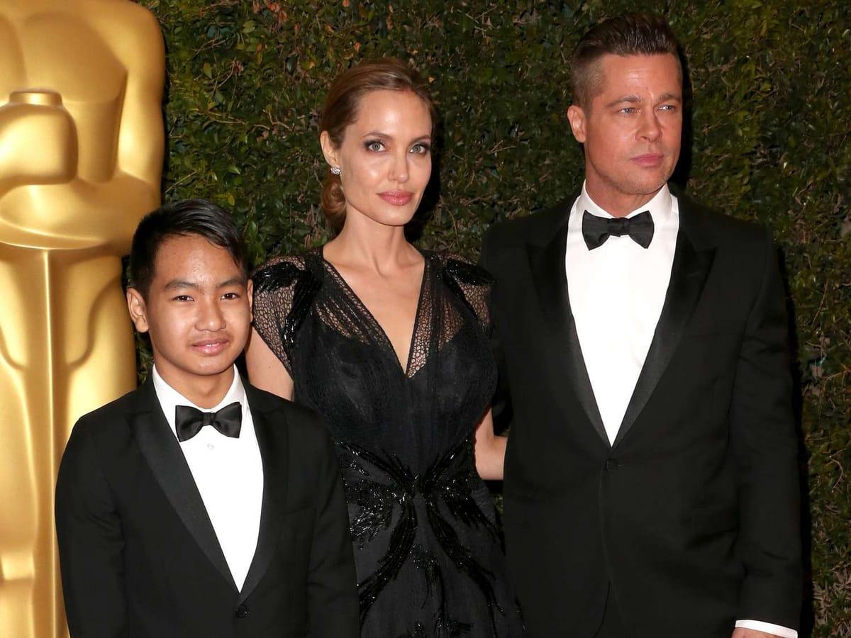 Brad Pitt and Angelina Jolie pictured together with their children in an older family photo.
