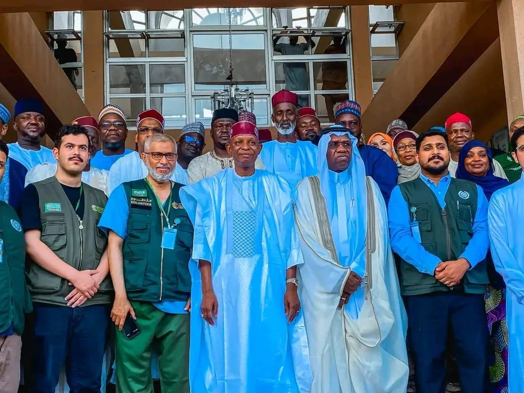Kano State Governor Abba Kabir Yusuf (center, red cap) with officials from the King Salman Humanitarian Aid and Relief Center at an event in AKTH Hospital, Kano.