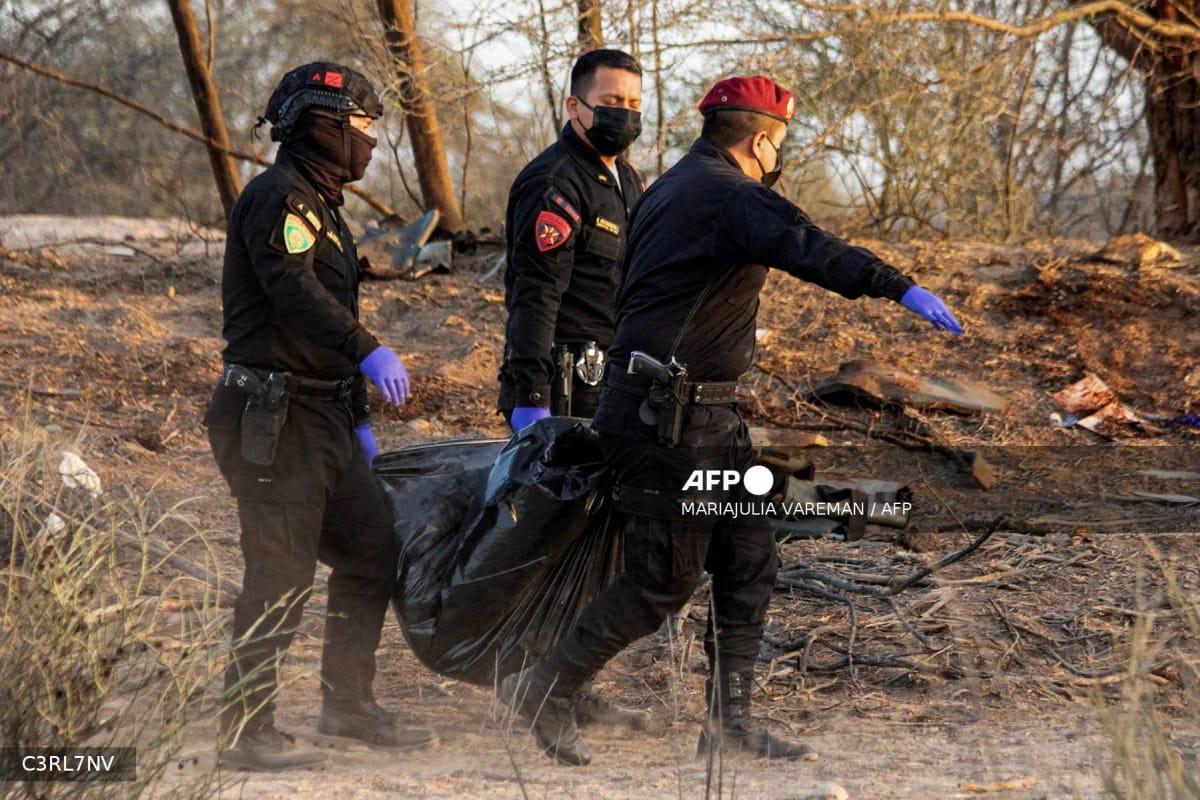 Police officers at the crash site in Vista Alegre, Peru