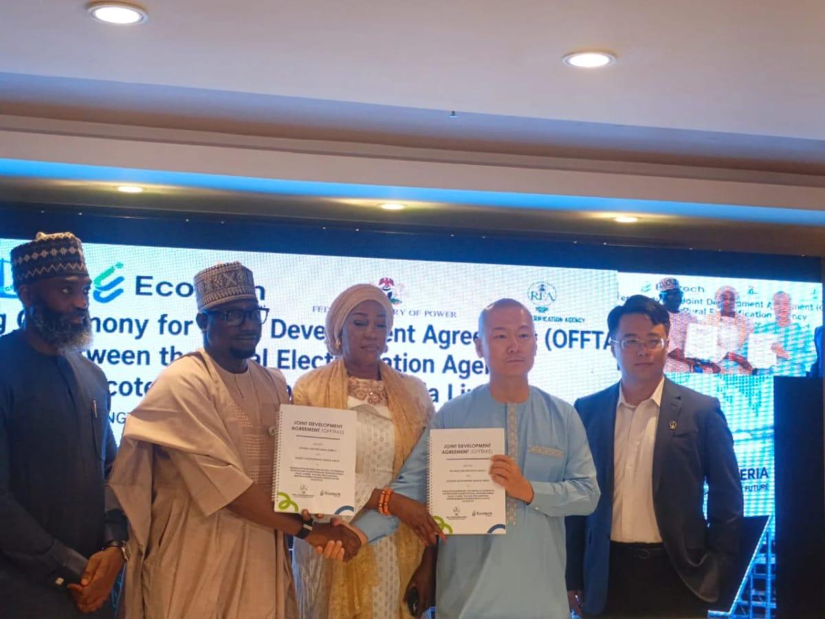 REA Managing Director/CEO, Abba Aliyu, and Ecotech Development Nigeria Limited Managing Director, John Zhao, during the signing of a Joint Development Agreement in Abuja on Tuesday. Credit: Solomon Odeniyi