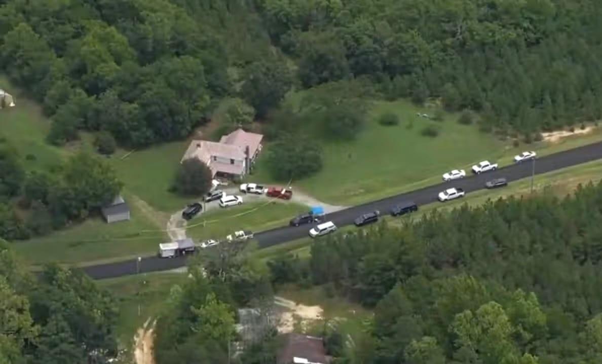 Police tape cordons off an area as investigators examine the site of a fatal shooting incident in Caswell County.