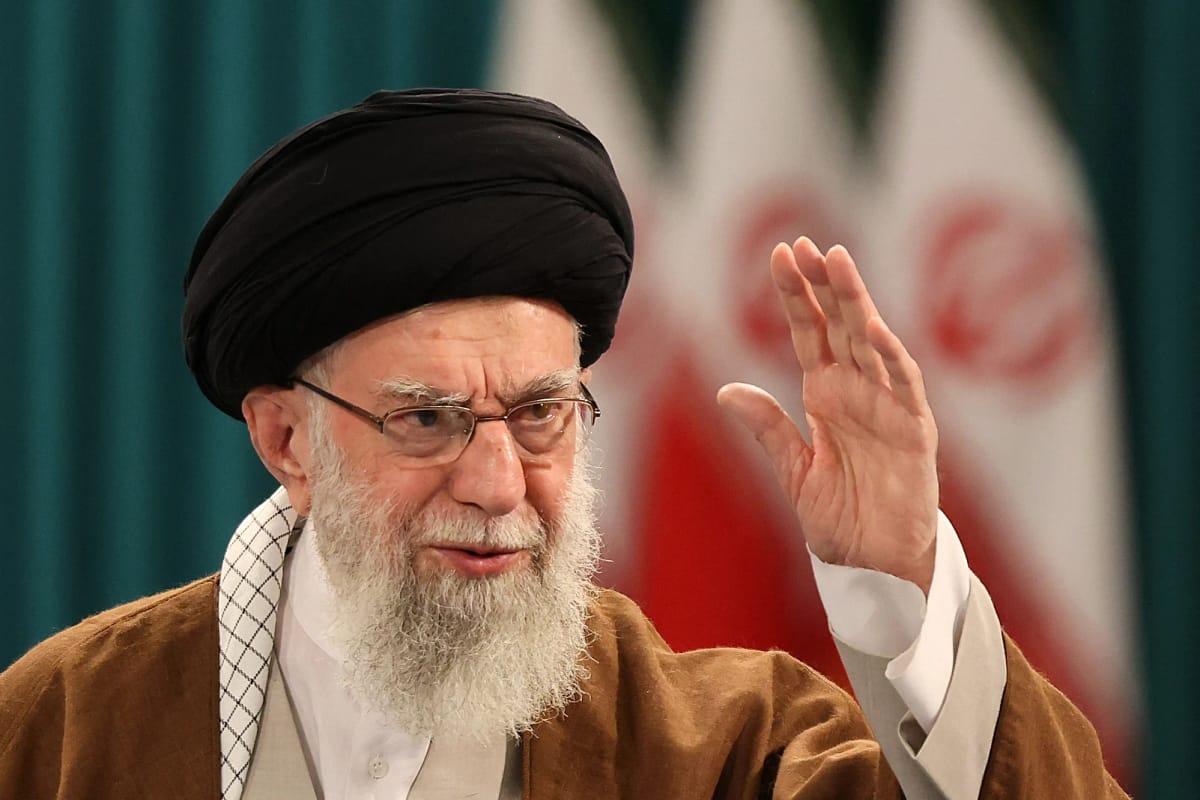 A solemn portrait of the former Iranian Supreme Leader, Ayatollah Ali Khamenei.