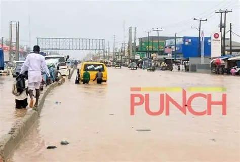 The Lagos-Abeokuta expressway submerged by floodwaters during a heavy downpour in 2024.