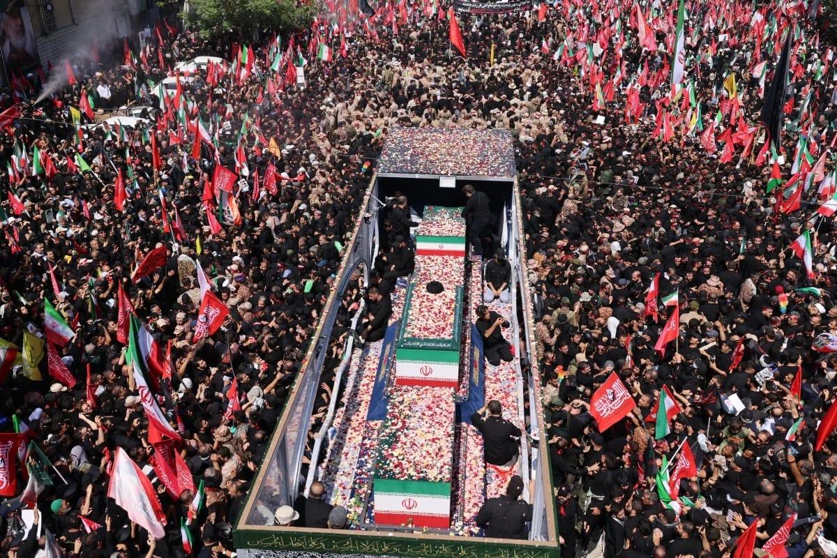 Iranian citizens, draped in black, fill the streets of Tehran to participate in the funeral ceremonies for Supreme Leader Ali Khamenei.