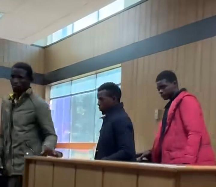 The three siblings, accused of murder, being escorted to the Mbabane Magistrates Court.