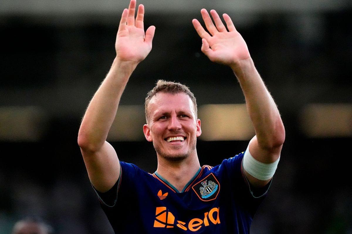 Newcastle United's Dan Burn acknowledges supporters after a match.