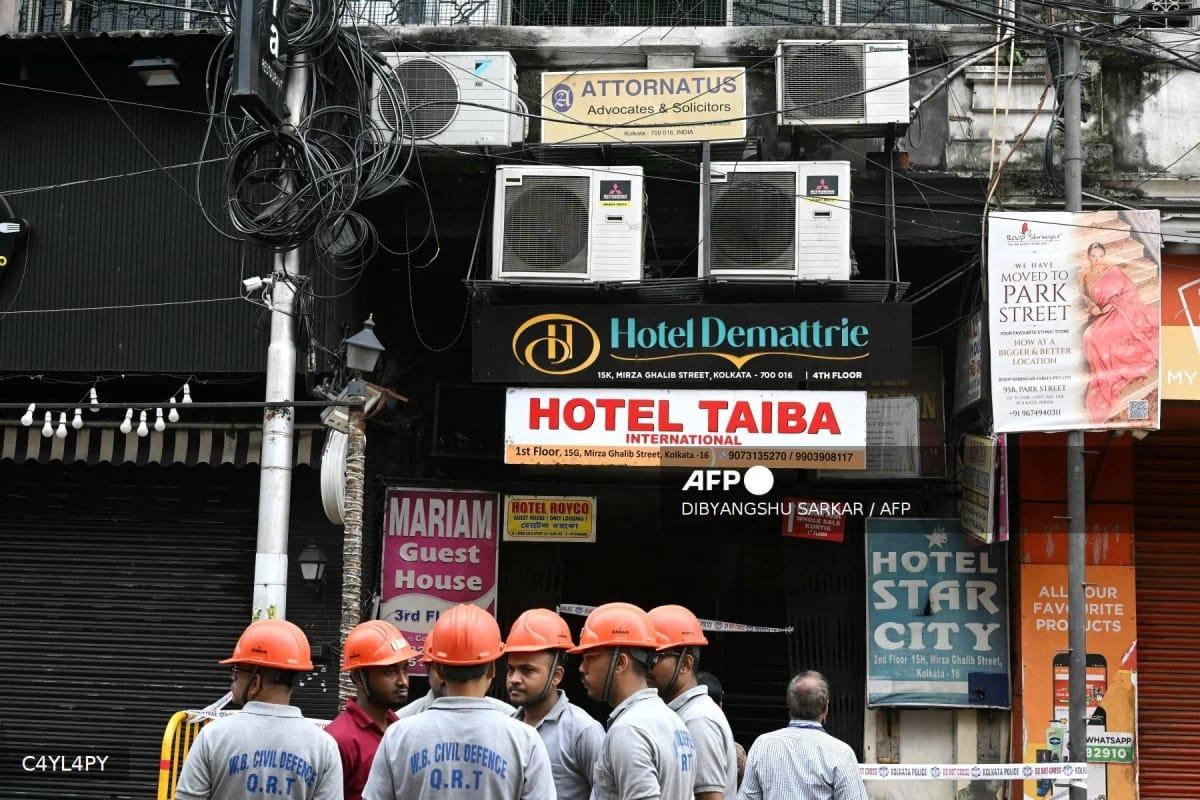 Civil defence personnel inspecting the site after a hotel fire in Kolkata on August 19, 2026, which claimed nine lives.