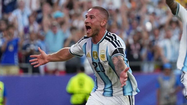 Argentina's Alexis Mac Allister celebrates after scoring the opening goal against Switzerland.