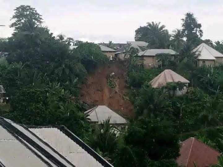 Community members assessing the damage after the Calabar landslide.