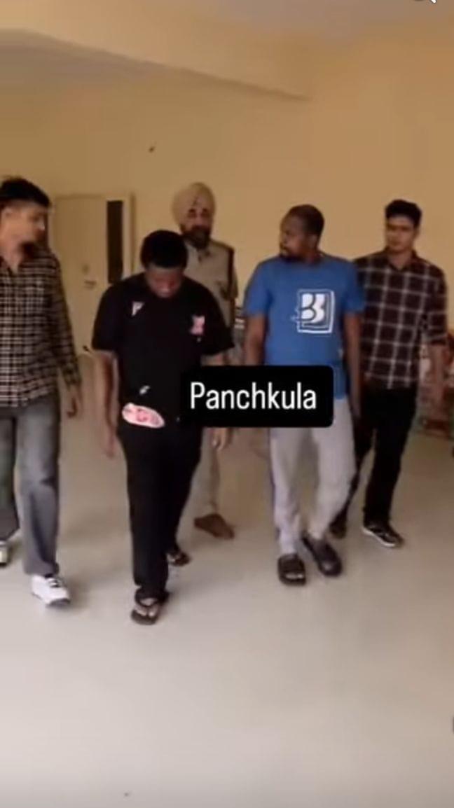 Law enforcement officers during an arrest operation for cybercrime suspects.
