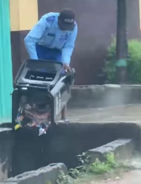 Lagosians Blame LAWMA as 56-year-old School Guard Caught Dumping Trash in Drainage