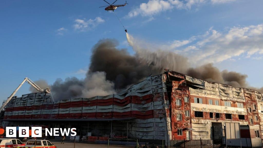 Firefighters battling blazes at warehouses hit by Russian missiles in Kyiv