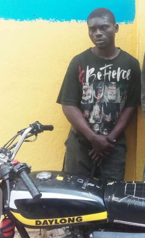 The suspect, John Keba, being taken away by the authorities