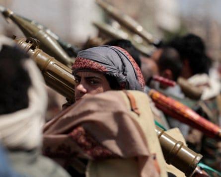 Fighters carrying shoulder-launched rocket-propelled grenades