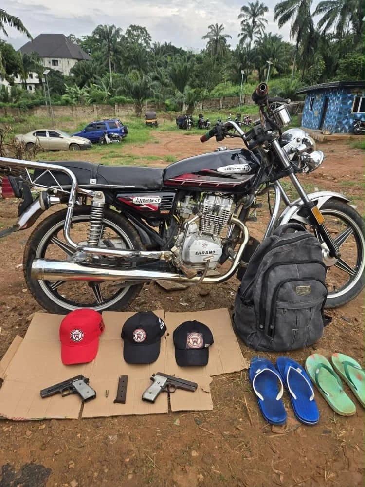 The recovered items, including two locally fabricated pistols and three cult caps