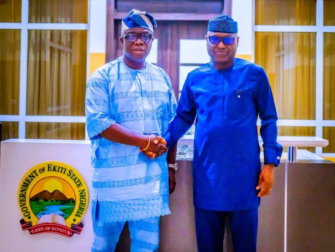 Dr. Wole Oluyede and Governor Biodun Oyebanji engaging in discussions.