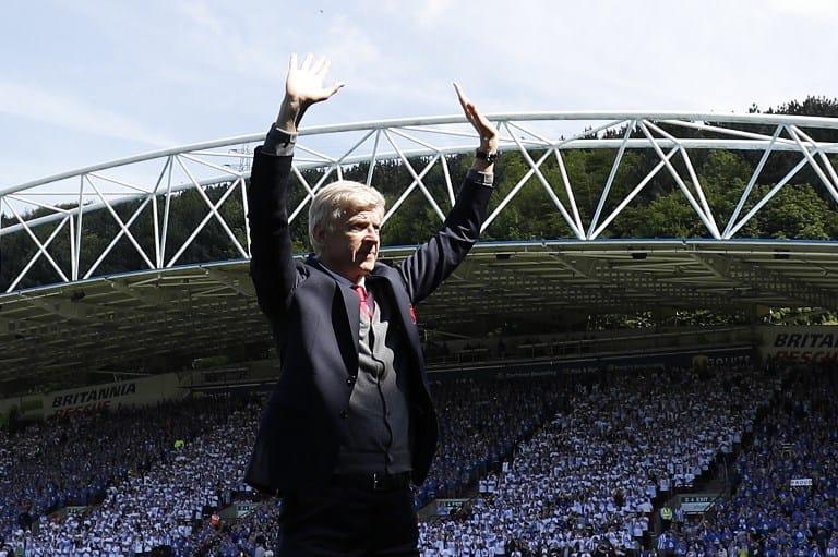 Former Arsenal manager Arsène Wenger waves to fans during his final match for the club in 2018.