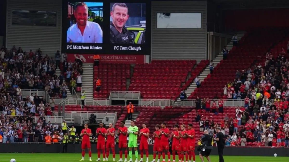 Photographs of PC Matthew Blades and PC Tom Clough displayed on the stadium screen during the tribute.