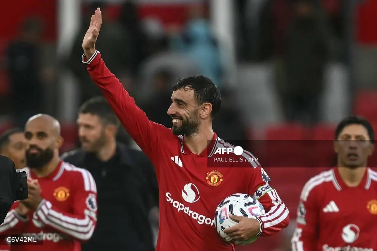 Portuguese midfielder Bruno Fernandes acknowledges the fans at Old Trafford after scoring a hat-trick for Manchester United against Ipswich Town.