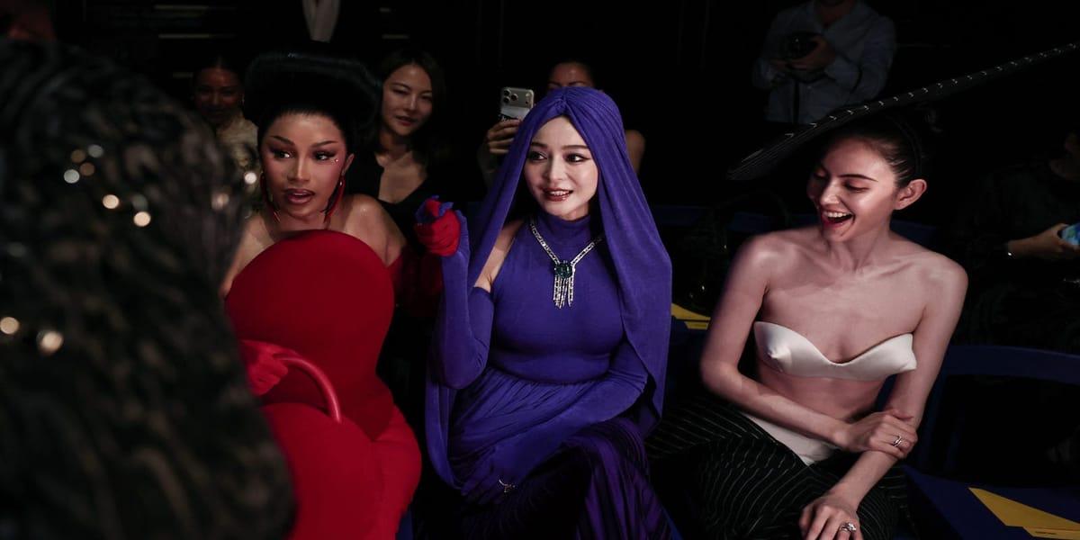 The striking red ensemble worn by Cardi B, featuring a sculpted mermaid gown and opera-style gloves.